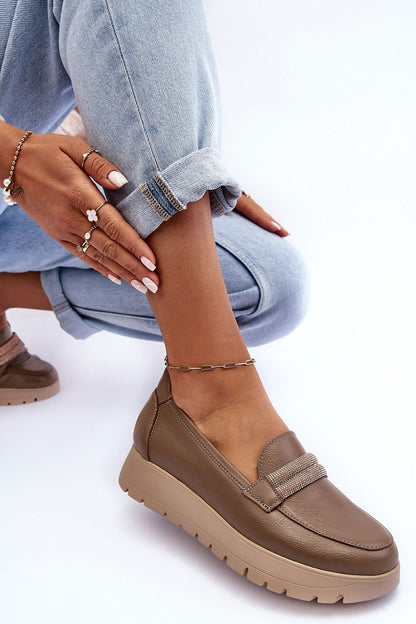 Sleek natural leather women's slip-on shoes featuring a chic design and cushioned footbed for all-day wear, ideal for sophisticated style.