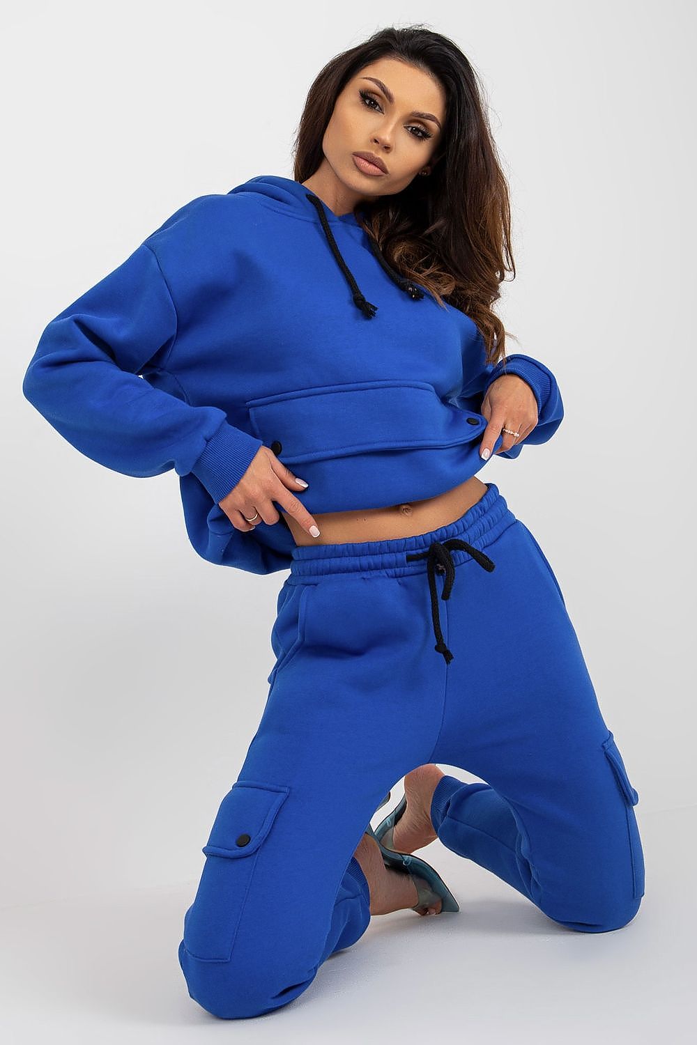 Detail of the cargo pants with thigh pockets, highlighting their unique design and comfortable fit for versatile everyday wear.