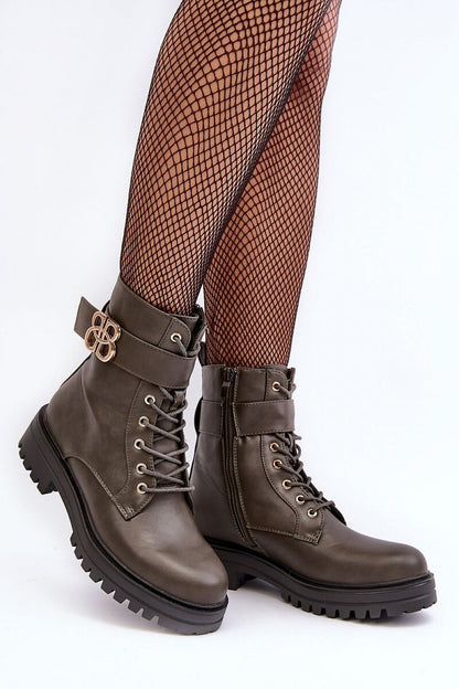 Close-up view of the elegant artificial leather finish on luxury women's boots with a stiffened heel counter and a flat heel for comfort.