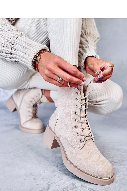 Close-up view of the stylish lace detailing on women's organic suede lace-up boots with a 6cm heel, showcasing premium craftsmanship.