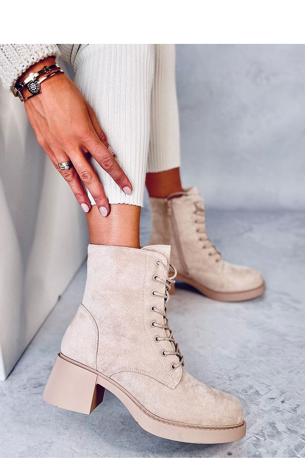 Luxurious women's lace-up heeled boots crafted from organic suede, featuring a 6cm wide heel and plush fur lining for unparalleled comfort and elegance.