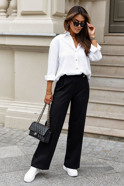 Close-up of IVON luxury women's shirt detailing gold buttons and wide cuffs, crafted from breathable Lyocel fabric for ultimate elegance.