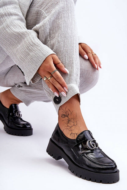 Elegant women's leather slip-on half shoes featuring a stable heel and platform, showcasing natural leather craftsmanship and luxurious design.