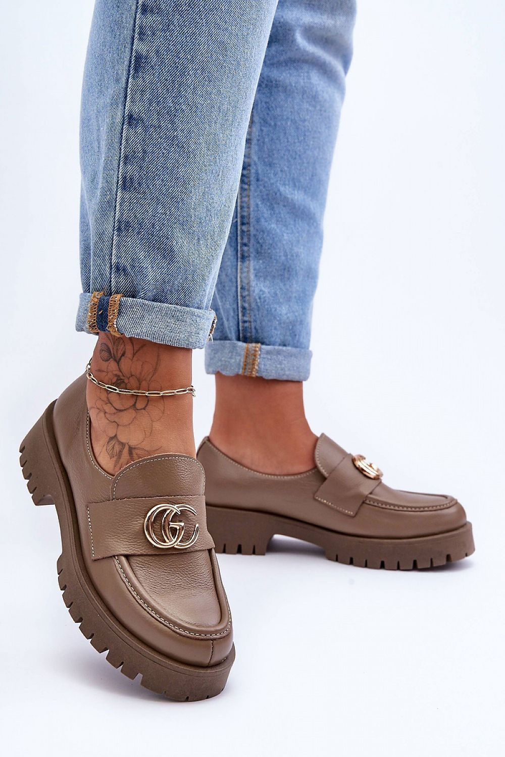 Sophisticated women's slip-on half shoes with elastic band detail for a perfect fit, combining luxury and practicality in footwear.