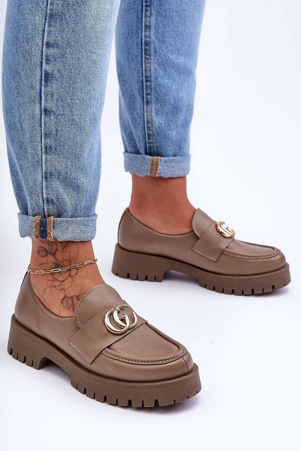 Elegant women's leather slip-on half shoes with a stable heel, showcasing a luxurious design and natural leather finish.