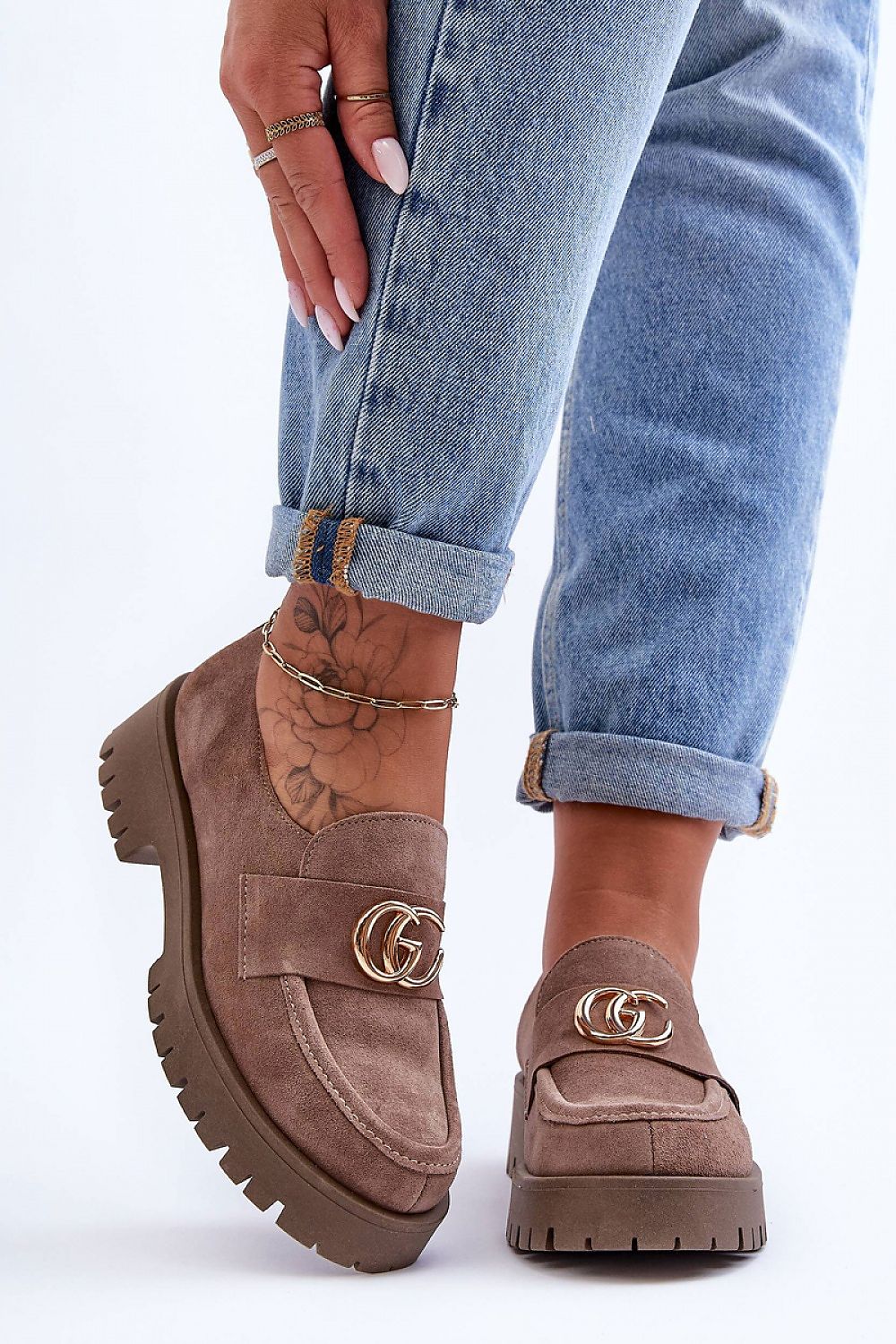 Stylish women's slip-on half shoes made of premium leather with a flat stable heel, ideal for both casual and formal wear.