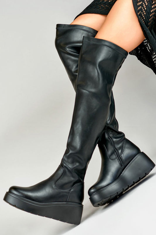 PRIMO Eco Leather Long Buskin Boots elegantly displayed, featuring luxurious fur insulation and a stylish anchor heel, perfect for cold winter days.