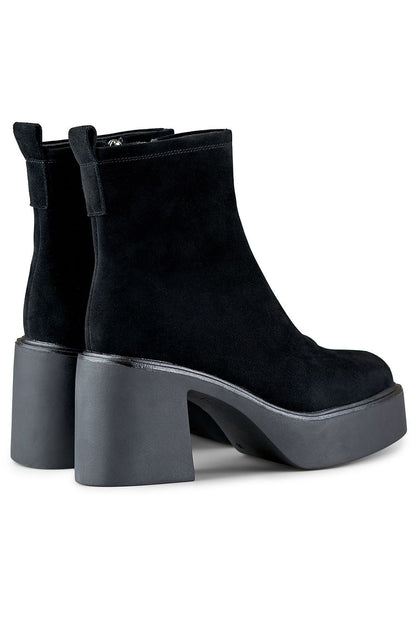 Side view of PRIMO high heel boots with a sleek design, durable natural leather exterior, soft fur interior, and a fashionable 8cm stiletto heel, ideal for chic winter ensembles.