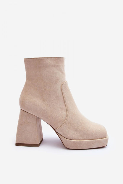 Fashionable women's high heel boots in eco-suede, designed with square toes and a zippered interior, combining style and practicality for a chic winter look.