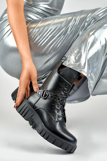 Chic PRIMO ankle boot showcasing a modern round toe design, crafted from durable eco leather with a distinctive buckle accent, ideal for both city outings and casual gatherings.