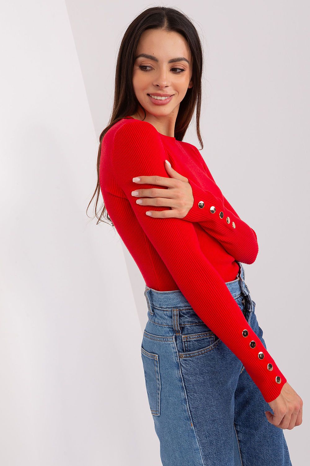 Model wearing an elegant viscose sweater with unique button sleeves, perfect for stylish autumn and winter outfits.