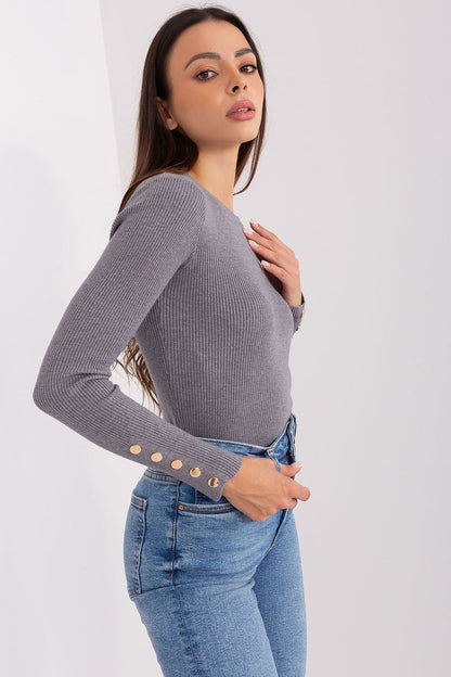 Close-up of textured ribbed fabric of an elegant viscose sweater, exemplifying sophistication for cold weather fashion.