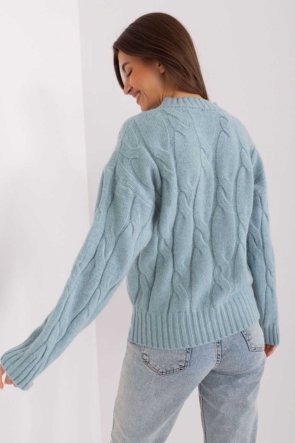 Elegant women’s acrylic sweater featuring long sleeves and round neckline, designed for comfort and luxury in professional settings.