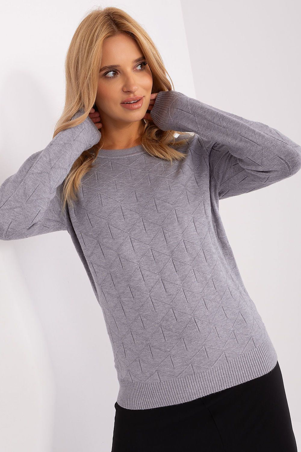 Chic close-up of the stylish women's cotton jumper showcasing its soft texture and subtle patterns, ideal for a fashionable look.