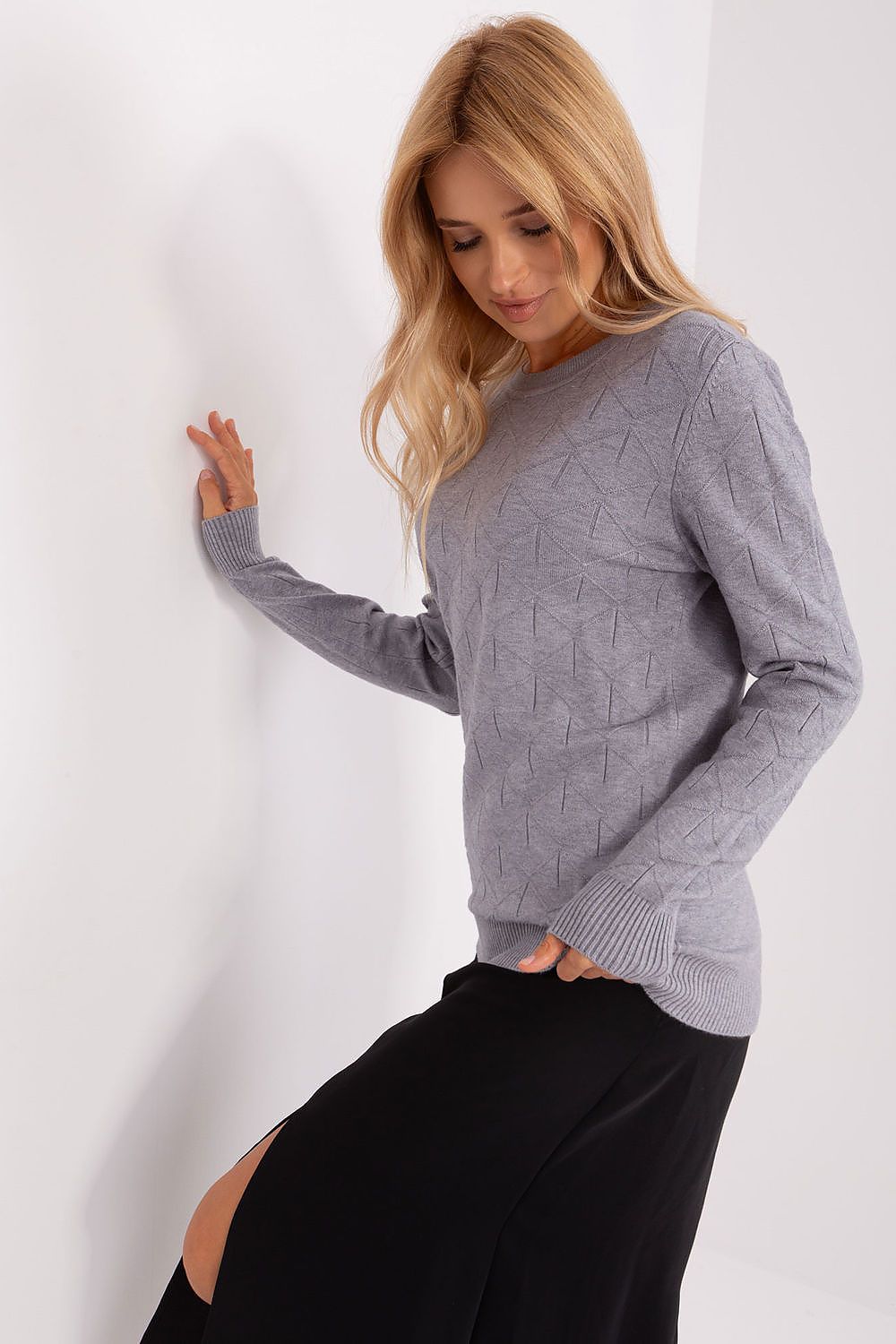 Versatile women's jumper styled with tailored trousers, demonstrating its adaptability for both casual and stylish occasions.