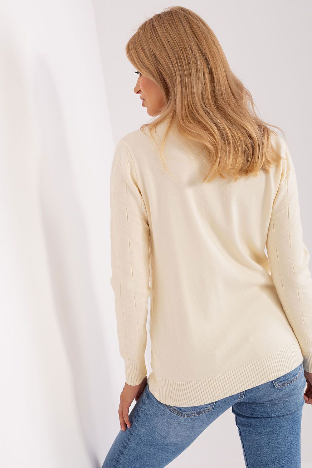 Women’s chic cotton-blend sweater displayed on a model, demonstrating its flattering fit and versatility for both casual and formal occasions.