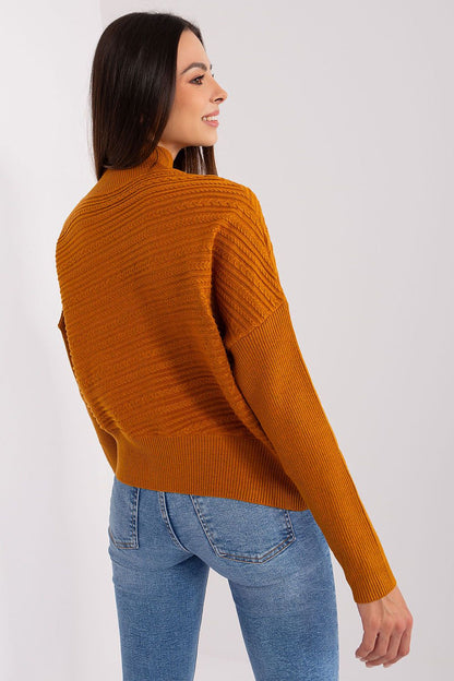 Close-up of the unique fabric texture on the luxurious women's knit sweater, showcasing its cosy feel and elegant design.