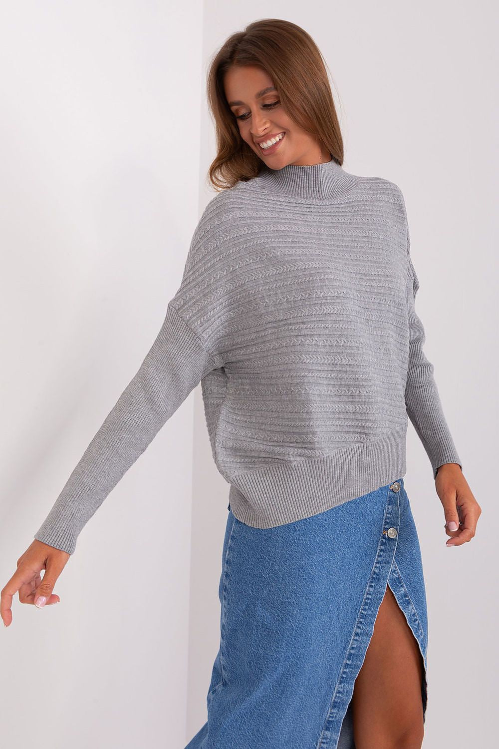 Luxurious women's variegated knit sweater featuring a chic low turtleneck and long sleeves, ideal for casual elegance.