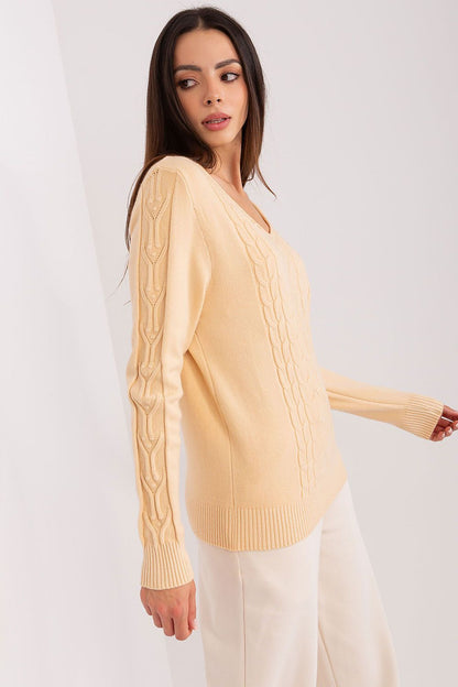 Luxurious close-up of the variegated fabric texture of the women's V-neck sweater, showcasing its soft cotton blend.
