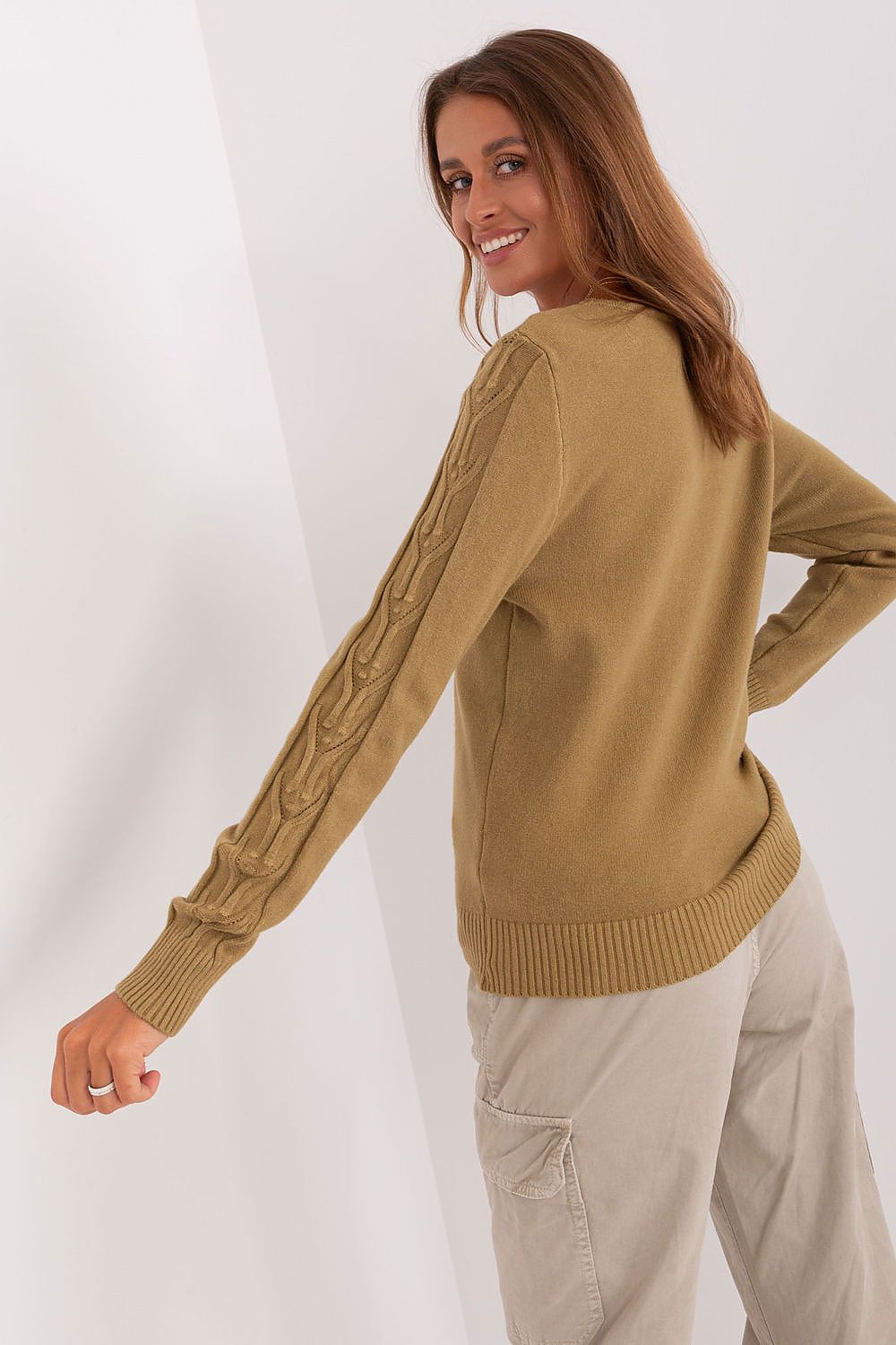 Close-up of luxurious variegated texture on a women's V-neck sweater, ideal for casual elegance.