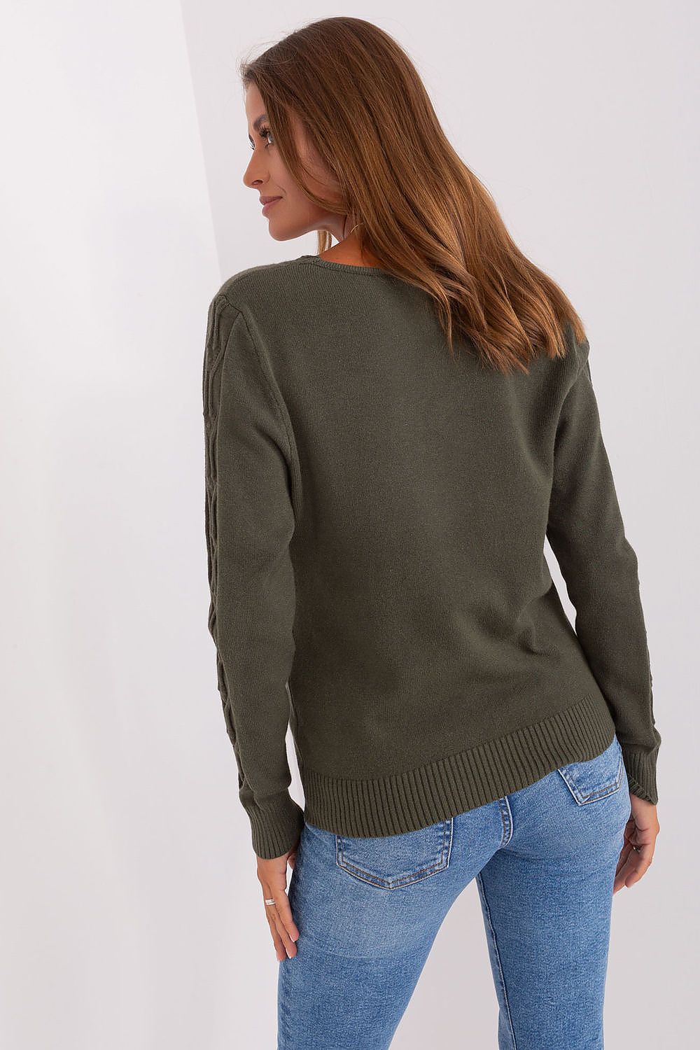 Elegant outfit styling featuring a women's variegated texture V-neck jumper, perfect for casual outings and meetings.