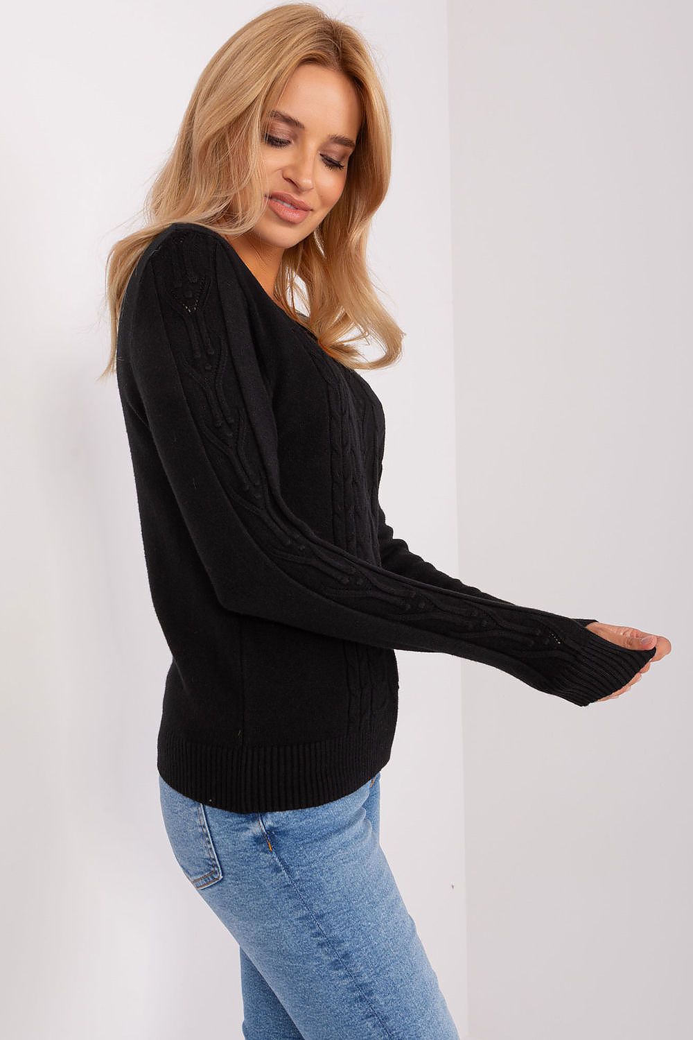 Fashion-forward women's jumper crafted from a comfortable cotton-polyester blend, displaying unique textured patterns suitable for casual outings and refined occasions.
