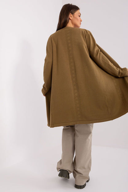 Luxurious knee-length women's cotton cardigan featuring an elegant openwork pattern, designed for comfort and style, perfect for casual outings.