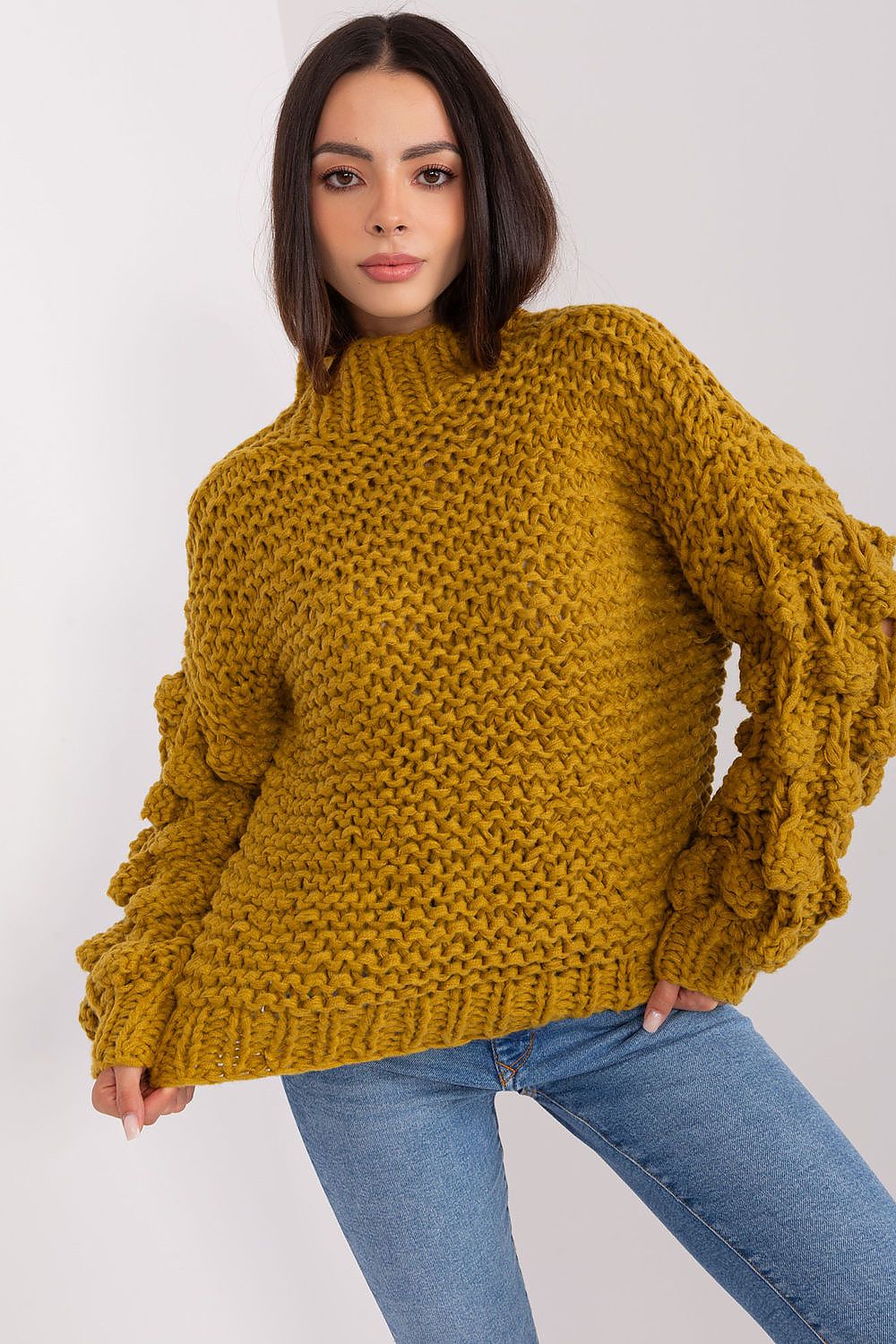 Elegant women's puff sleeve sweater featured in soft polyester with a stylish round neck, perfect for a chic winter look.