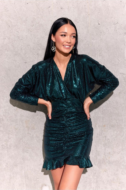 Stylish ruffled hem of the mini dress by Roco Fashion, emphasizing the fashionable design and exquisite details for a standout evening look.