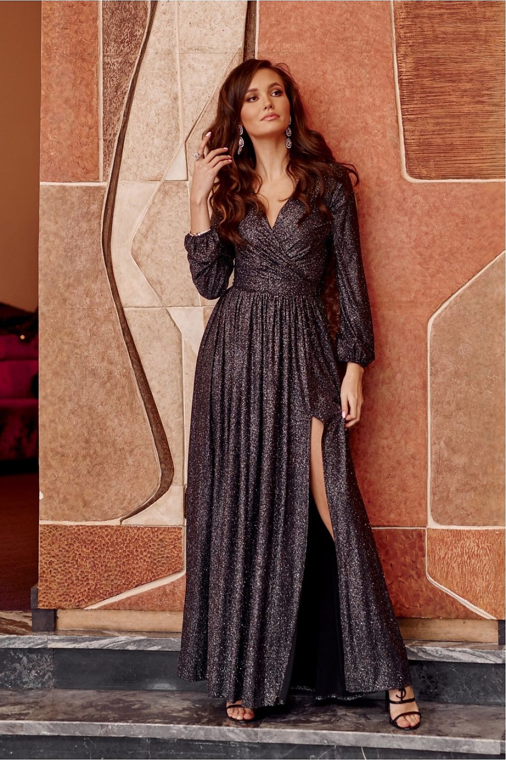 Elegant brocade maxi dress by Roco Fashion featuring a stylish cutout and waist-defining belt, perfect for special occasions and formal events.