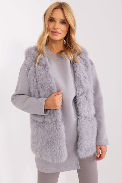 Luxurious polyester fur vest by AT featuring practical pockets, perfect for autumn and winter styling.