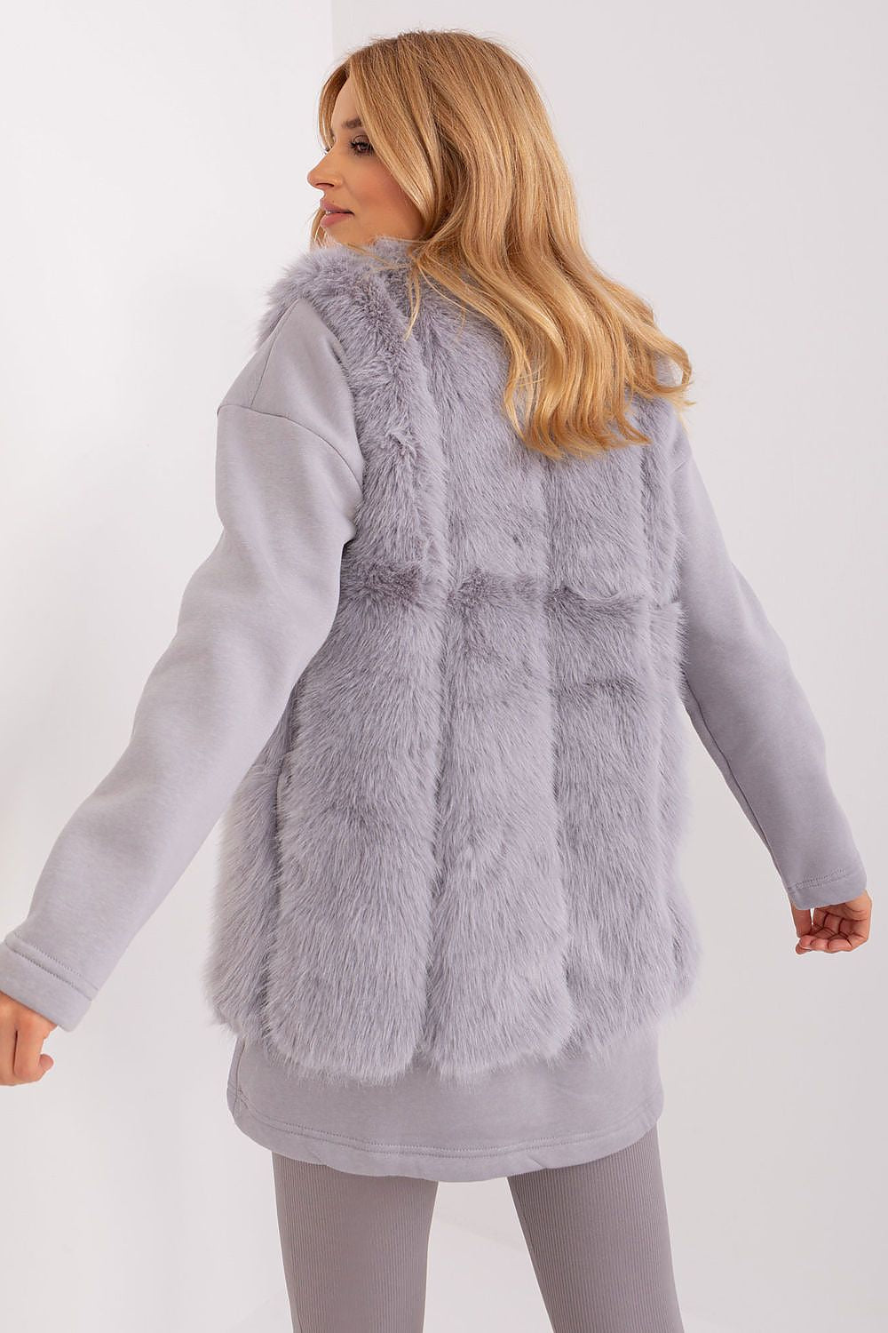 Elegant fur vest in standard length by AT, designed for comfort and warmth in autumn and winter fashion.
