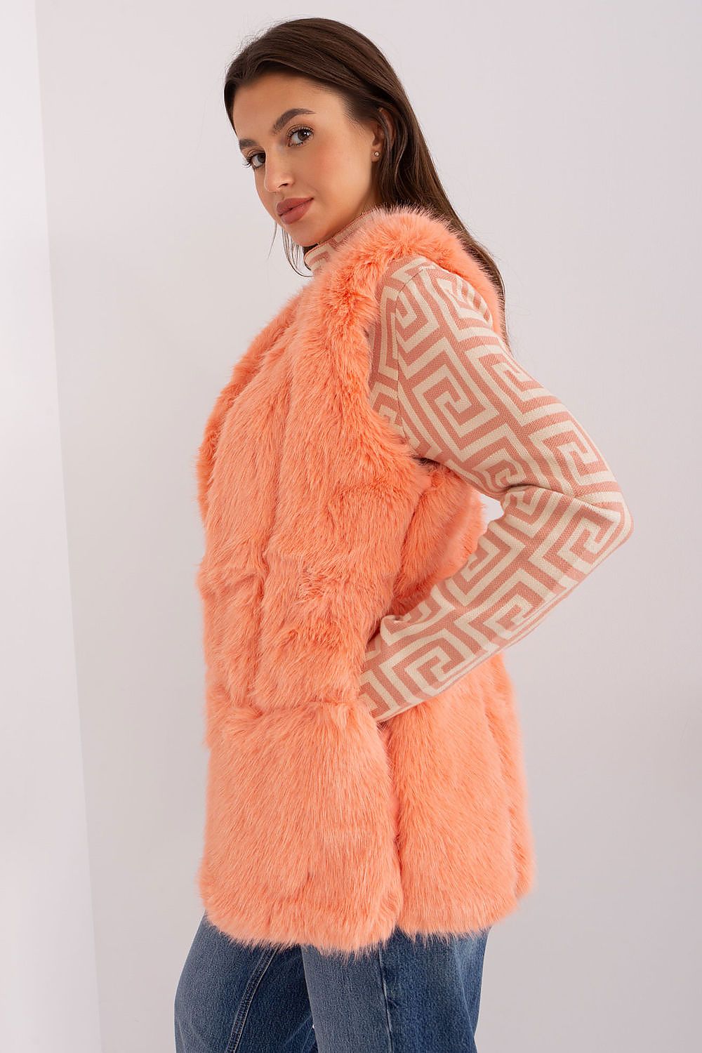Elegant polyester fur gilet from AT, ideal for layering on cool days, showcasing its stylish pockets.