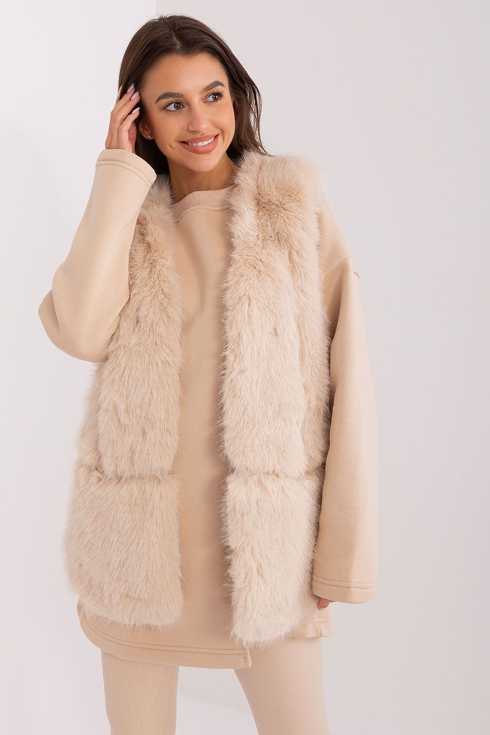 Chic polyester fur vest designed by AT, providing warmth and elegance for casual autumn outings.