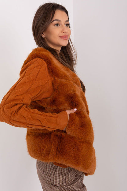 Luxurious women's fur vest by AT with soft polyester fabric, featuring practical pockets and elegant design for casual outings.