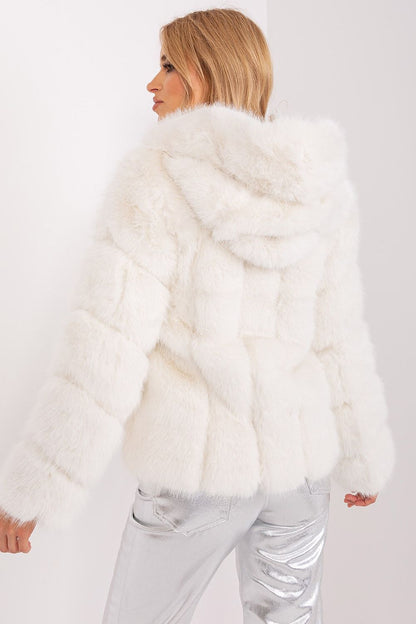 AT elegant 100% polyester fur jacket with hood and pockets, perfect for cold days, showcases luxury style and comfort.