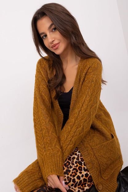 A model wearing the Elegant V-Neck Cardigan by AT, paired elegantly with jeans, highlighting its versatile style.