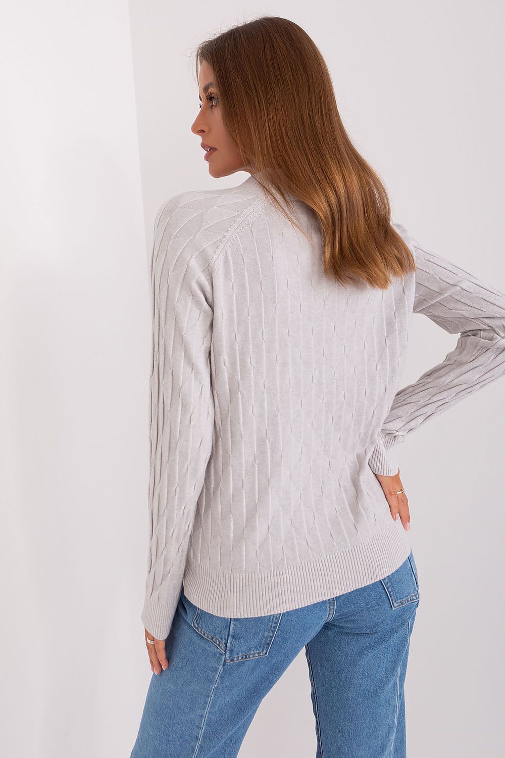 Close-up of the variegated fabric texture of the AT women's sweater, showcasing luxurious comfort and style for any casual occasion.