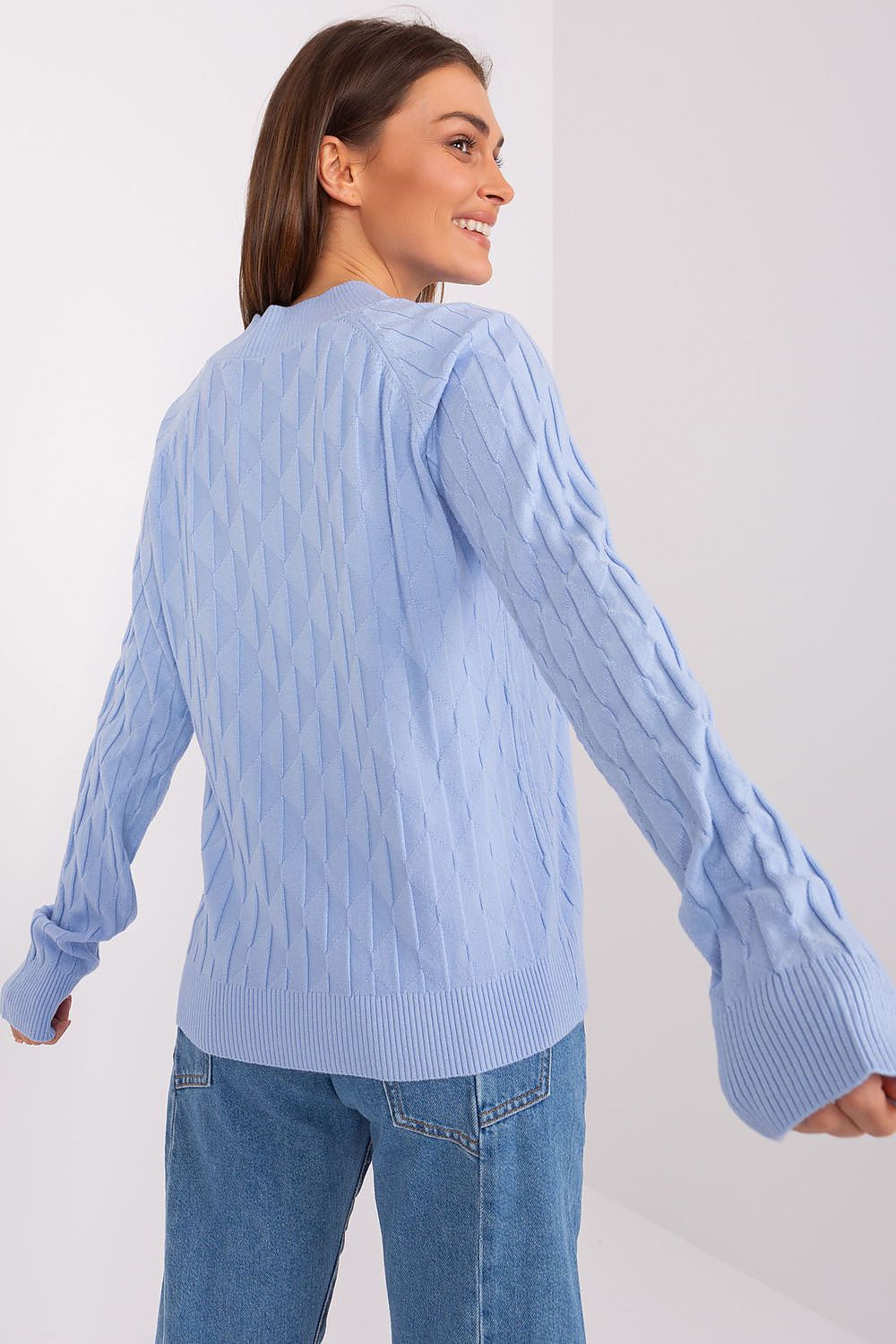 Elegant women's variegated sweater by AT with round neckline, showcasing its unique texture and luxurious style in a casual setting.