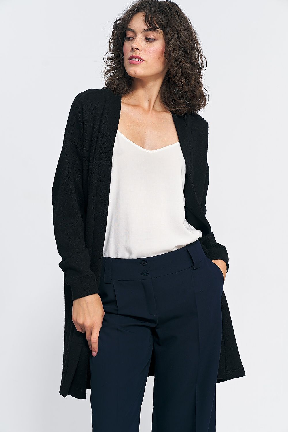 Luxury unbuttoned black cardigan by Nife, crafted from soft knit fabric, ideal for stylish weekend wear.