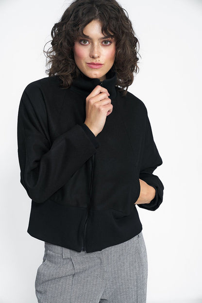 Close-up of the luxurious fabric details of the Nife Timeless Black Jacket, highlighting its premium polyester blend and sophisticated minimalist aesthetic perfect for elegant autumn looks.