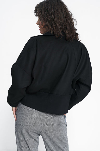 Timeless Minimalist Black Jacket by Nife showcasing its elegant straight cut and practical pockets, ideal for stylish autumn wear.
