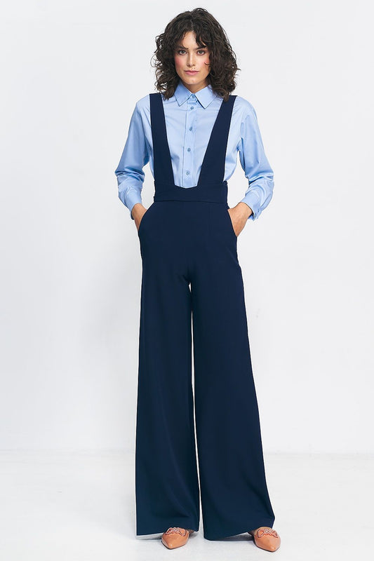 Elegant high-waisted jumpsuit by Nife featuring suspenders and pockets, showcasing a vintage-inspired wide leg design in luxurious fabric.