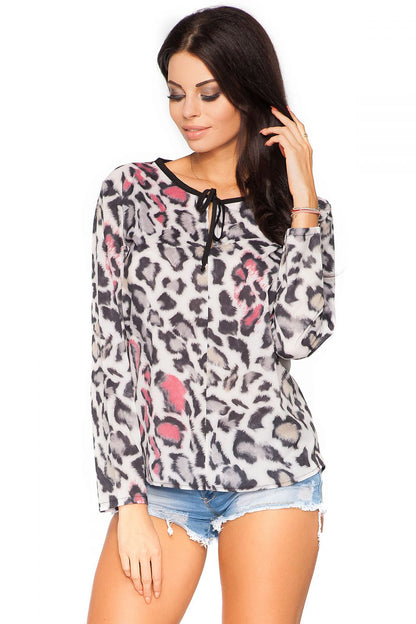 Elegant chiffon blouse by Tessita featuring teardrop detailing and a versatile tied neckline, perfect for upscale occasions.