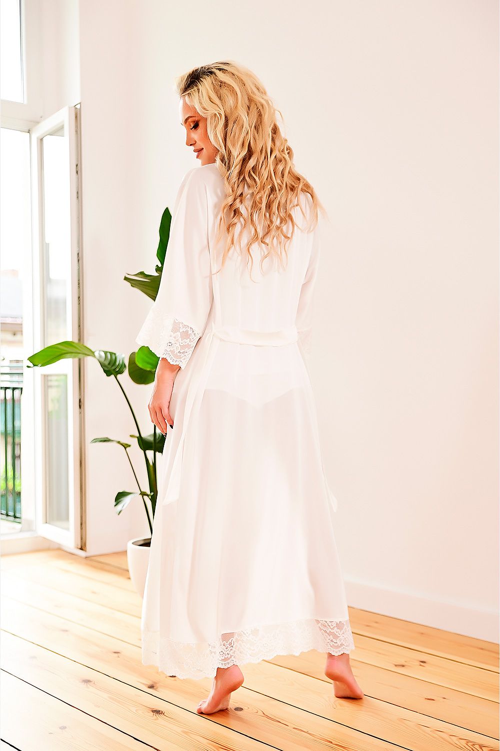 Elegant women's gown by Kalimo, featuring delicate satin fabric and exquisite lace accents, ideal for a lavish bathing experience.