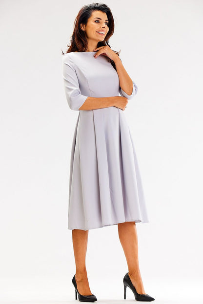Elegant flared daydress by Awama featuring 3/4 sleeves and a sophisticated boat neckline, perfect for upscale occasions.