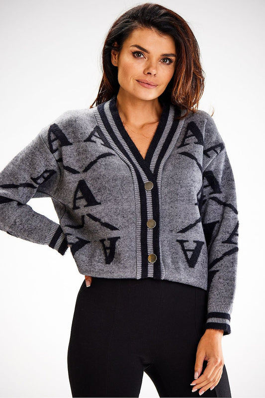 Luxurious two-tone short cardigan by Awama, crafted from a soft nylon blend, perfect for autumn and winter fashion. Features ribbed hem detailing for an elegant finish.
