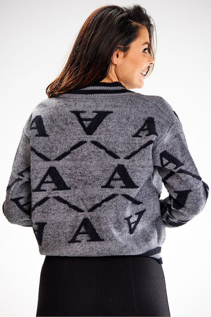 Chic close-up view of Awama's elegant two-tone short cardigan, highlighting the ribbed hem and luxurious nylon blend for ultimate comfort.