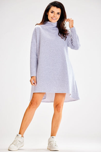 Awama Turtleneck Daydress in a stylish autumn setting, highlighting its comfortable loose fit and elegant design.