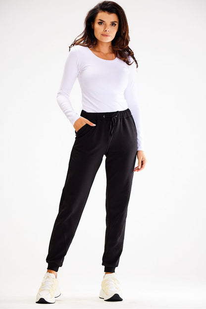Luxury Awama loose tracksuit trousers featuring a sophisticated elastic waistband and decorative stitching, perfect for an elegant yet relaxed look.